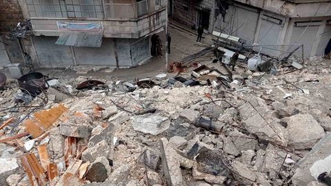 Rescue teams work to free those trapped under Aleppo's buildings in Syria