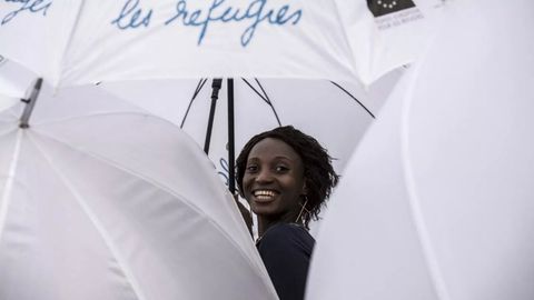Umbrella March in Lyon highlights refugee reception