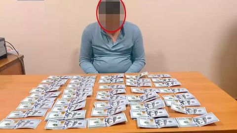 Қорақалпоғистонда Давлат меҳнат назорати инспекцияси ходими 10 минг доллар пора билан қўлга тушди