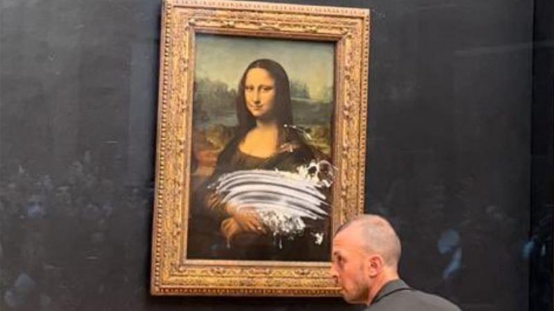 Luvrda “Mona Liza” kartinasiga tort chaplashga urinishdi (video)